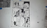 Completed comic page with inks